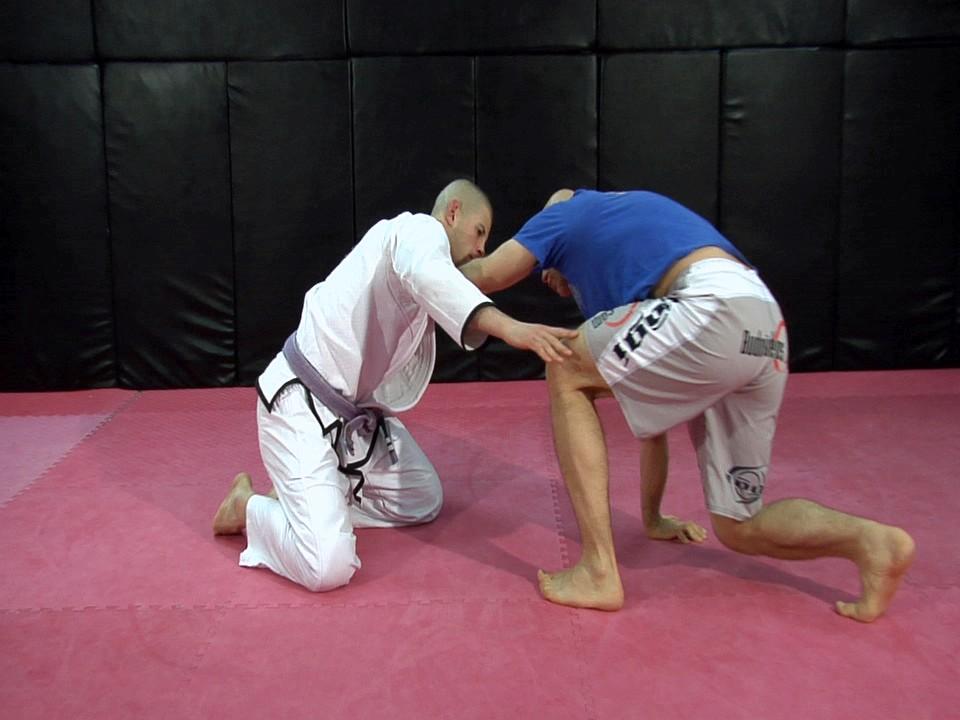 And back off, squaring up and possibly coming back to my feet. Whenever I do this technique, I know that he s going to probably grab at my trailing leg.