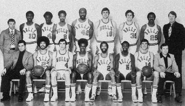 1974-1975 CHICAGO BULLS Left to right: (front row): Assistant Coach Ed Badger, Rowland Garrett, Jerry Sloan, Bob Wilson, Norm Van Lier, Leon Benbow, Matt Guokas, Head Coach Dick Motta.