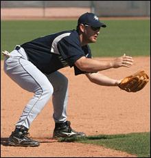 INFIELDER PROPER POSITION BEND AT THE KNEES AND THE