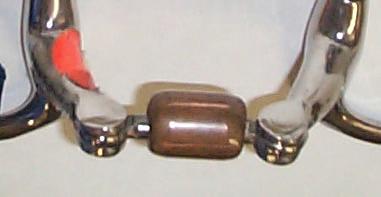 Snaffle bit with copper inlaid mouthpiece.