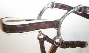 noseband, buckles and a small disk of sheepskin, which may be used in the intersection of the two leather straps of a crossed noseband, the noseband must be made entirely of leather or