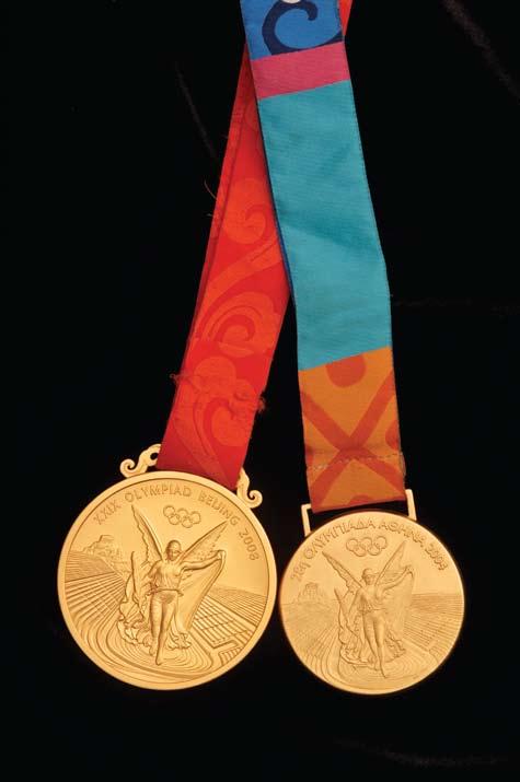 PHOTO by ROBIN JERSTAD PURE GOLD: Tamika Catchings two Olympic gold medals.