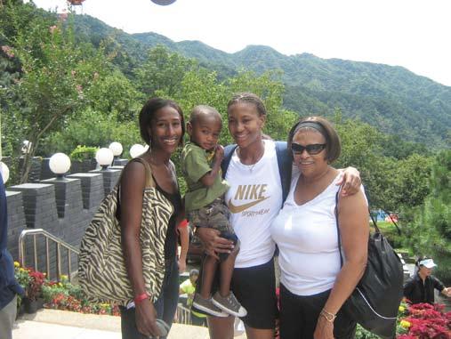 PHOTO Provided by TAMIKA CATCHINGS GREAT ACCOMPLISHMENTS: Tamika s sister, Tauja, her nephew, Kanon, Tamika and her mom, Wanda, at the Great Wall during the Beijing Olympics.