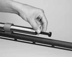 Simply pull the three-shot adaptor (plug) out of the magazine tube with your fingers to remove it (Figure 8). You may also hold the shotgun upside down to make it slide out.