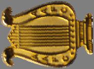 Band or Drum Corps Badge 11 Qualification Stage Proficiency 12 A gold badge in the shape of a lyre with AAFC on both sides. A blue three bladed prop on a circular, gold background.
