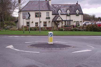 on a domed central island in tarmac creating a small roundabout, not a miniroundabout Photograph 6: Non-conforming central marking in setts with white edge marking 2.