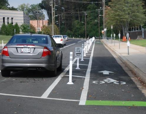 Separated bike lanes (also known as cycle tracks) are bicycle-only facilities that are separated from auto traffic by a physical barrier, such as parked cars, bollards, a landscaped buffer, or a curb.