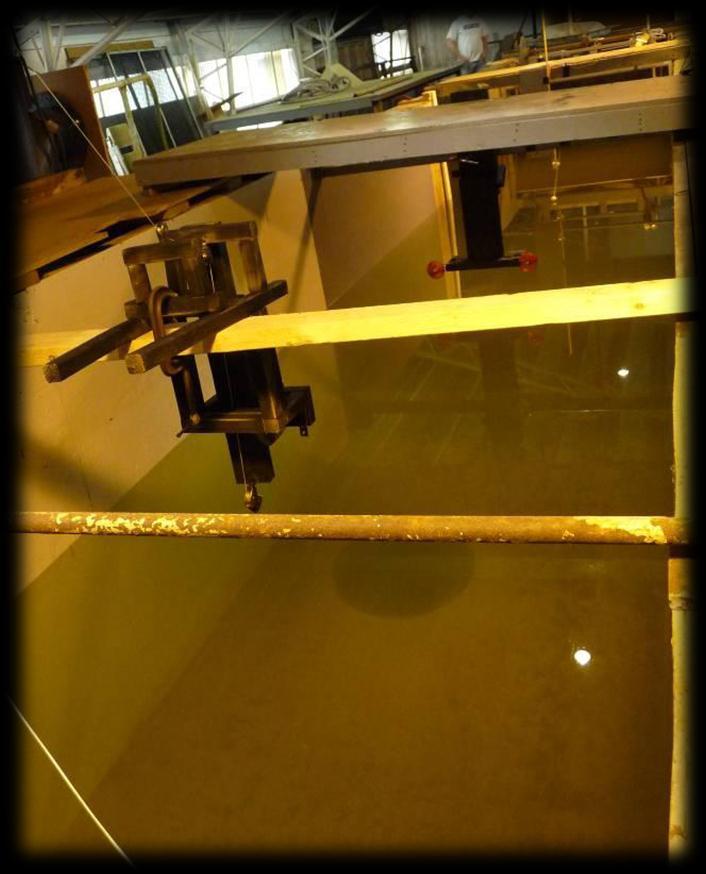 determined that 4 plates was the ideal number so that the waterline was slightly below the tank cover, and the draft was approximately 60cm, as desired. 4.10 Design of Testing Configuration To accomplish the goals of this MQP, the team tested the wind turbine model in a water flume provided by Alden Research Laboratory in Holden, MA.