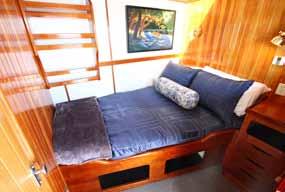 Cabin Features Category 1 Outside door, opening portholes, private ensuite head, storage, natural light.