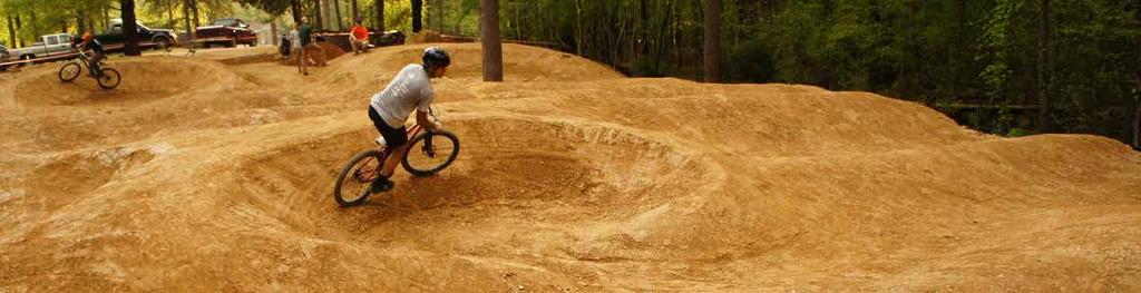 PUMPTRACK DEFINED A closed circuit track consisting of berms, rollers, and mounds that are spaced and shaped in such a way as to allow the rider to
