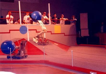 1995 - Ramp N Roll In two minute matches, three robots race down a 30-foot raceway, over a speed bump just wide enough for two to pass through, to retrieve their 24 and 30 vinyl balls.