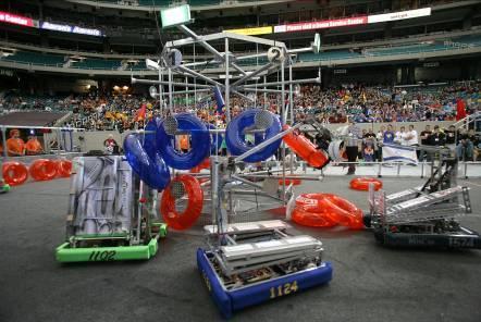 2007 - Rack N Roll In the 2007 game, Rack N Roll, students robots are designed to hang inflated colored tubes on pegs configured in rows and columns on a 10-foot high center rack structure.