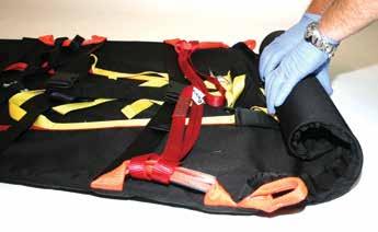 stretcher and its restraints are exposed.