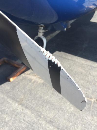 After the go-around, the pilot performed a second landing attempt using only 10 flaps resulting in a normal landing. On post flight inspection, the aircrew noticed the missing tail tie down ring.
