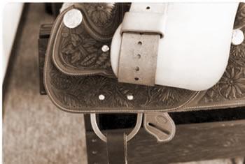 Round ring and dee-ring riggings are made by doubling a strong piece of skirting leather around the hardware and attaching it to the tree with screws.