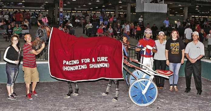 PROFILE Gesek Family A WINNING DAY: MS survivor Shannon (second from right, and flanked by Janine and Jeff Gesek) was honored during a Pacing for the Cure Day at the Races event at Scioto Downs in