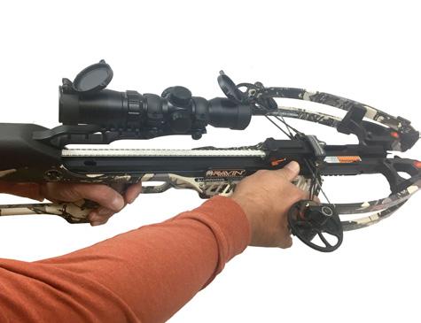 While firmly holding your Ravin Crossbow grip with one hand, rotate the cocking handle forward toward the top of your Ravin Crossbow with the other hand to retract