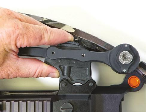 2. To attach the Quiver to the mounting bracket, press and hold the thumb release on the mounting bracket (Figure 7).