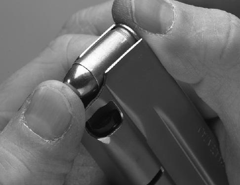 3 Insert the cartridges into the magazine by pushing them down and sliding them rearward with your thumb (Figure 6).