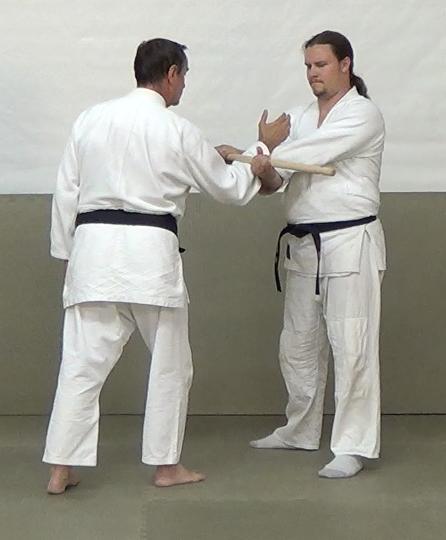 Figure 17. A full-scissor hold. As before, each of his hands is a fulcrum, your forearm is the resistance, and the pressure of his elbows toward the hanbo is the force.