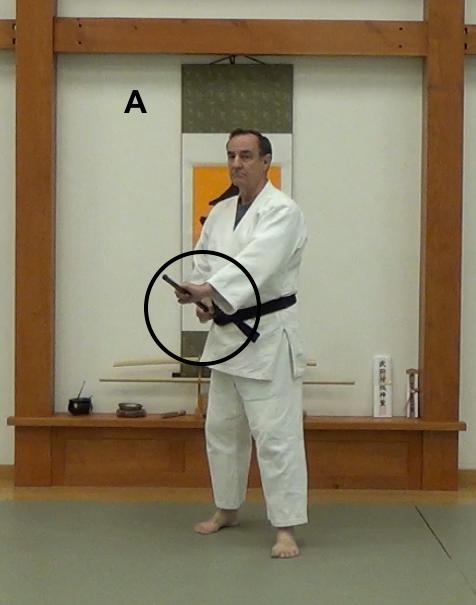 B Figure 3. An inefficient way to circle the tip over the wrist of an opponent who has gripped the hanbo.