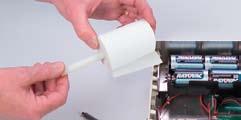 Remove the plastic paper holder rod from the paper holder bracket by applying a slight outward pressure to the