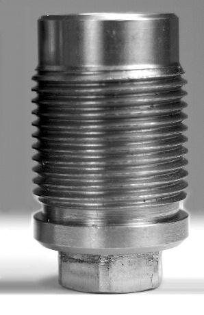 Only - it has an identifier groove to distinguish it from other breech plugs (FIGURE 28), which at a glance may have similar appearance.