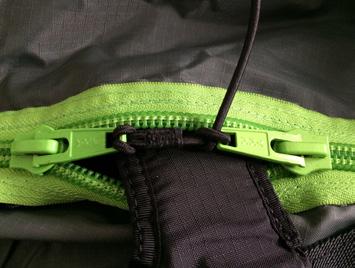 1 2 3 4 5 Zip your harness into the suit Flip the zipper and secure the button with the