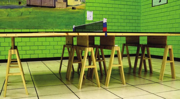 CLASSROOM TABLE THIS TABLE CAN BE ADJUSTED IN HEIGHT IN ORDER TO SERVE 2 PURPOSES: AS A SCHOOL DESKS AND AS A TABLE TENNIS TABLE. IT HAS BEEN TESTED BOTH IN SOUTH AFRICA AND KENYA.