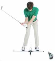 Set up your Golf Improvement System as shown with the Inner Swing Arm about 12-14 inches in