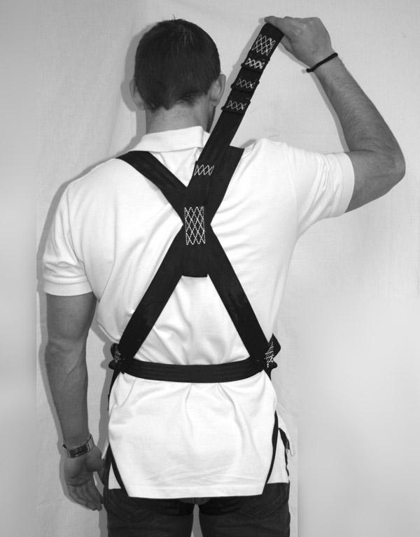 (Figure 6) STEP 7: Insert the end of the right leg strap through the first slot in the
