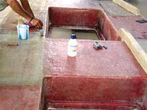 Make it thick enough to stay where put and wet enough to bond properly. It is important to do a dry fit to check that the hull and deck fit.
