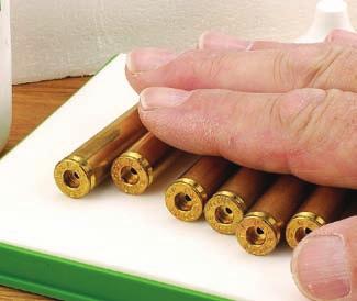 One obvious difference is that powder charges tend to be larger in rifle cases. Consequently, the powder measure must be able to dispense bulky, coarse-grained propellants.