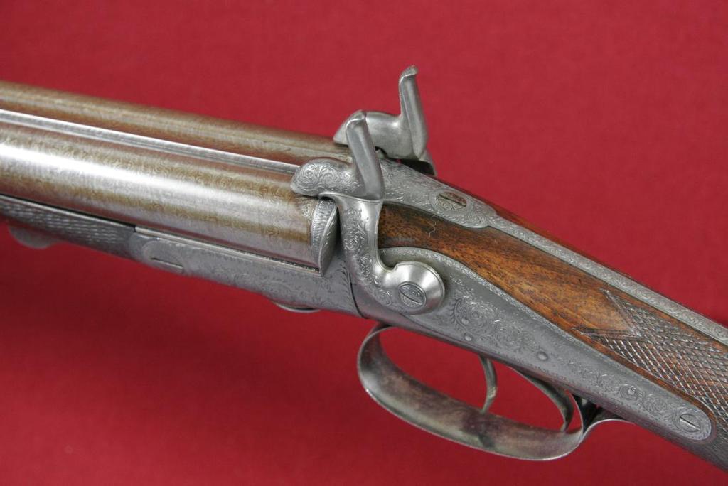 single bolt operated by a forward facing lever that lies under the forend when closed.