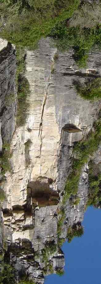 The line follows a series of cracks and corners topping out at the highest point on the cliff. Access: From below Year in Year Out, by the large boulders, a track leads to the base of the cliff.