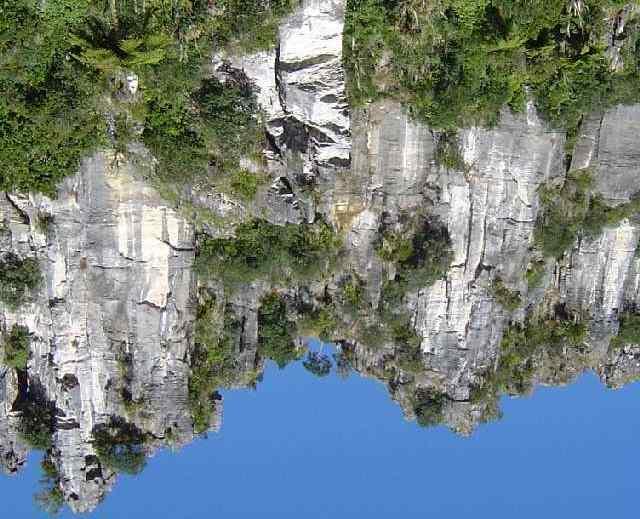 & centre of the Main Cliff. ** Year to Year (16) 40m A left tending crack system. Abseil off a DBC rap station in front of and to the right (true left) of the large Totara tree.