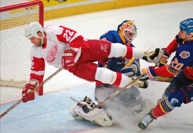 ... 14 The Best Game You Can Name.... 15 Glossary... 16 Red Wings player Dino Ciccarelli (22) is pushed into the Blues goalie John Casey during Game 7 of the Western Conference finals in 1996.