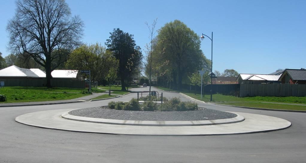 Figure 4-R Roundabout with Semi-Mountable Apron d) Roundabouts should be designed to ensure low entry and exit speeds.