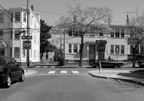 ) Mid-Block Island A physical device located on a segment of a street in order to reduce the width of the traveled way and provide a refuge for pedestrians.