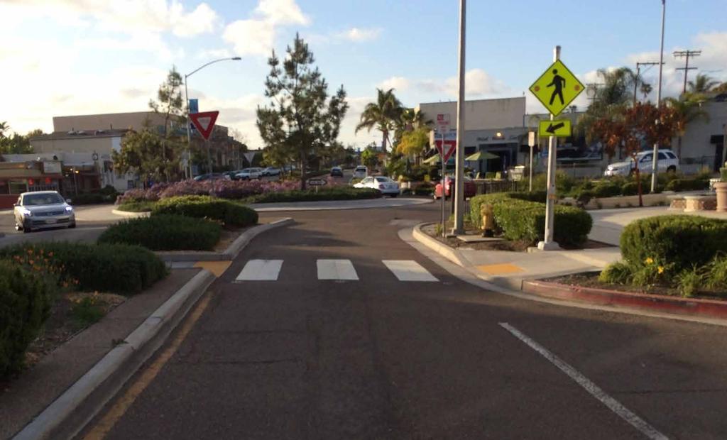 Objectives: Slow traffic speeds and improve traffic flow Implement roundabouts in place of traffic signals where feasible to reduce auto and pedestrian conflicts at intersections Add new mid-block