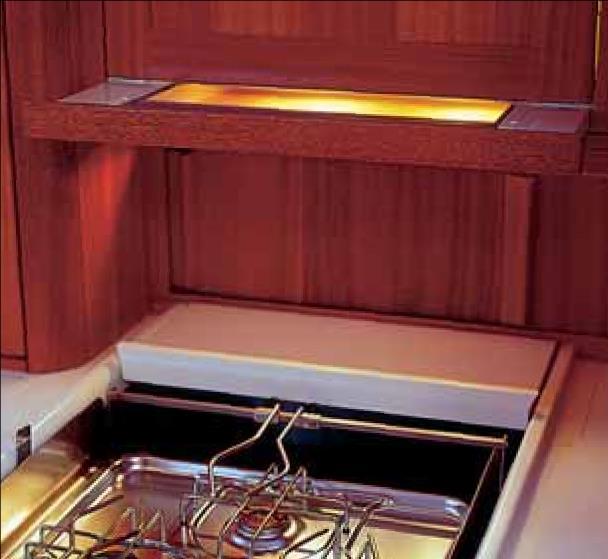 The refrigerator is hidden behind a wood panelled door. First class galley Food is an important part of harmonious living.
