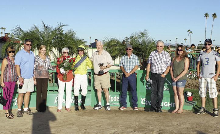 AUTUMN BLITZ ATBA Fall Sales Stakes Futurity Colts & Geldings Division ATBA Director Jan Osborn presented the bouquet of roses to Lila Lanning, Curt Lanning was presented with the Futurity Trophy and