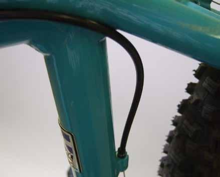 The next piece of housing runs from the top position of the second cable stop group on the top tube, across the back of the seat tube, and into the single