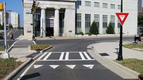 On streets with traffic speeds higher than 30 mph, it may be unsafe to cross without a median island.