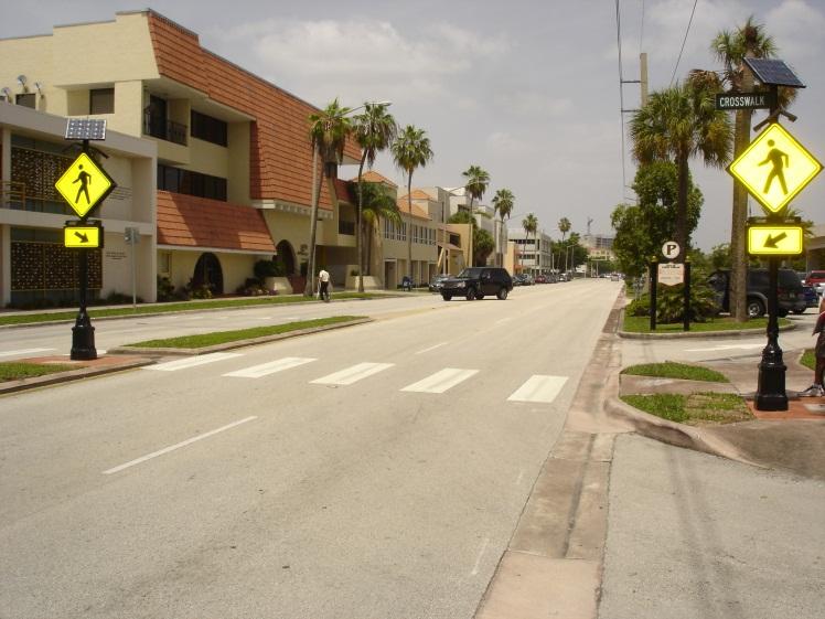 crosswalk to vehicles (see the image below image). Crosswalk lighting should provide color contrast from standard roadway lighting. Table 7.