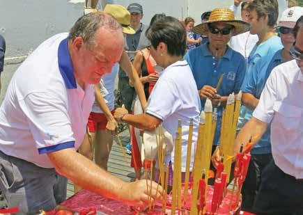 ABC officers, their families, and guests were invited to bow three times holding lit incense sticks, thereby blessing the boats and ensuring their safe travels.