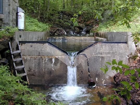 Figure 42. V-notch weir. The v-notch and rectangular weir can also be combined to provide an accurate flow measurement for both small and large flumes as demonstrated in figure 42.