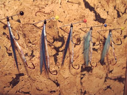 Getting the wing (the back-to-back hackles) to sit correctly is about the only trick to tying these lures. The wing must sit properly on the shank; if it s twisted, the lure will fish badly.