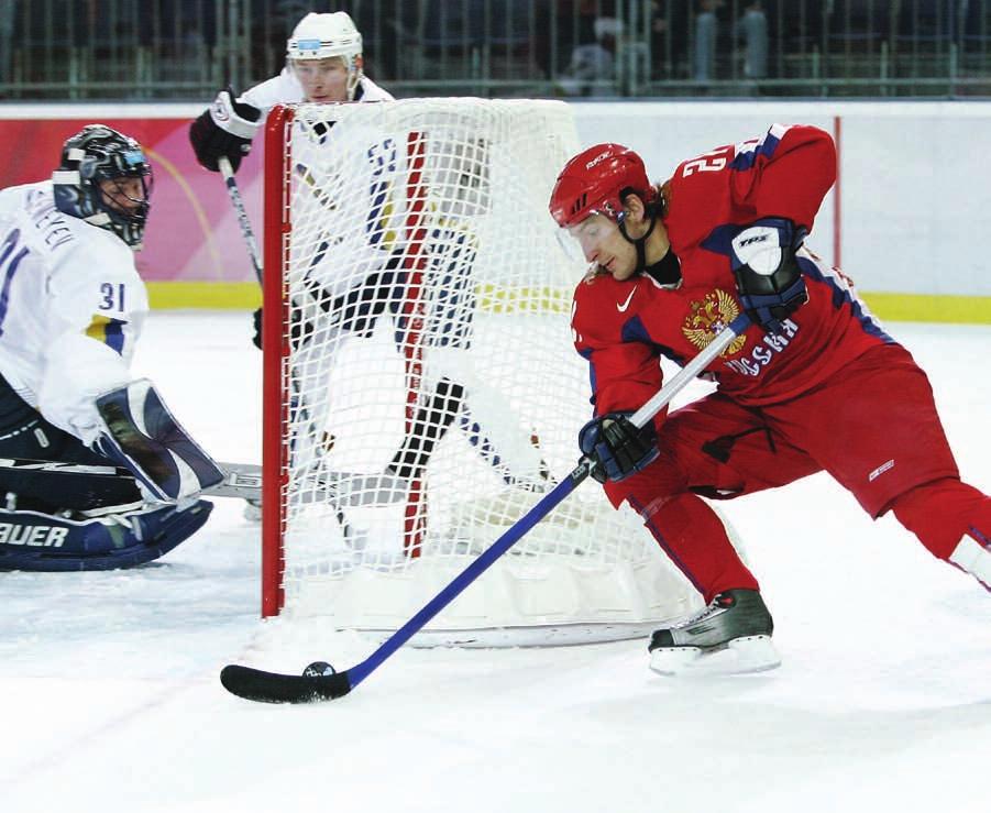 ICE HOCKEY: THE BASICS Alexander Kharitonov (RUS) scores a goal against Kazakhstan at the 2006 Games.