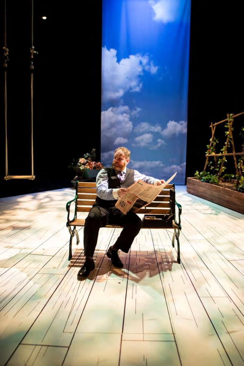 During the INTERVAL you will see a wooden bench, a small garden, a wheelbarrow of plants and a wooden swing.